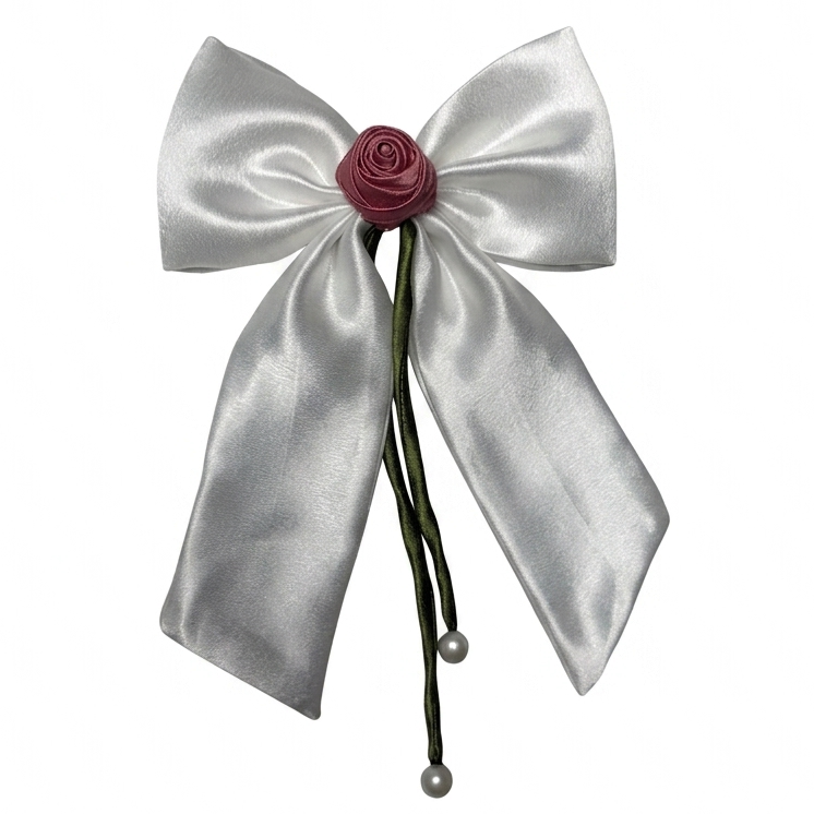 Handmade pure white silk satin hair bow with a pink rose center and pearl-tipped green ribbons